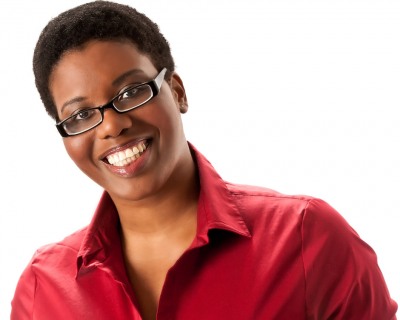 c55-06-Studio-headshot-on-white-background-of-smiling-black-woman-with-short-afro-and-red-shirt(Shamara-Loraine)