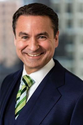 male-corporate-executive-headshot-window-background-new-york-city