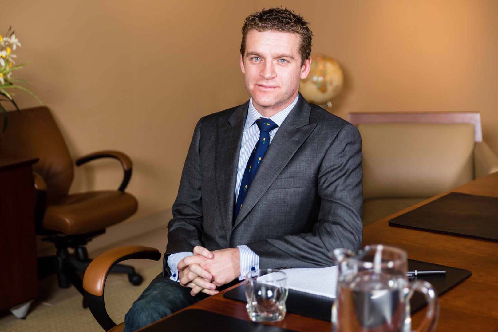 Real-estate-executive-at-desk Real-estate-executive-at-desk