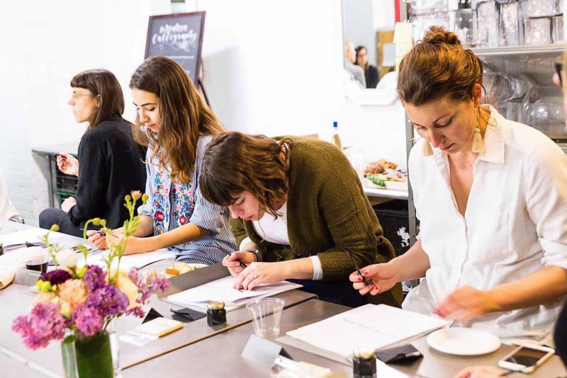 Calligrapher-instructing-students