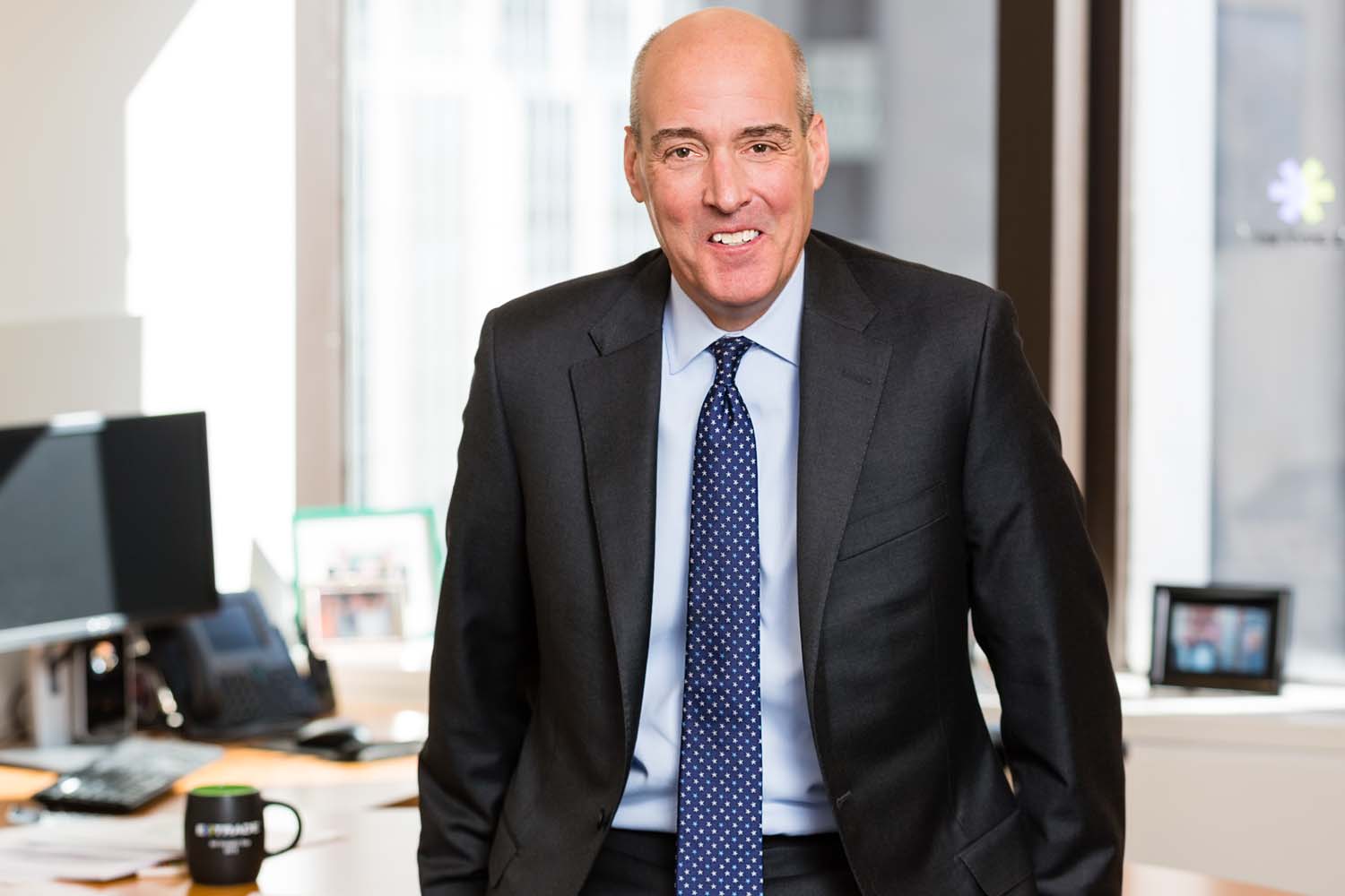 Financial-executive-environmental-sitting-on-desk Financial-executive-environmental-sitting-on-desk