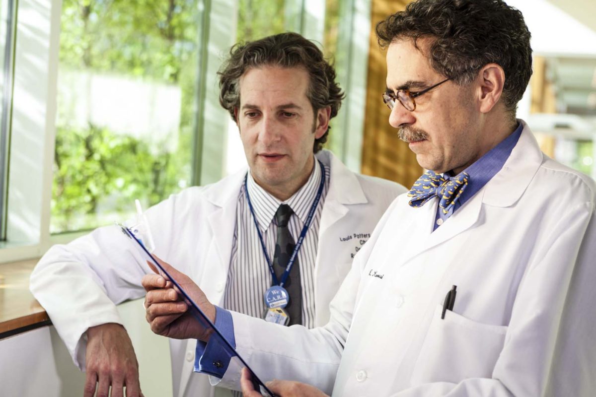 Environtmental portrait of doctors conferring