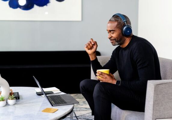 Man watching a video on a laptop
